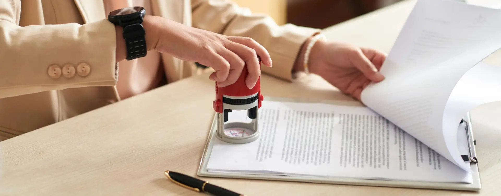 A notary carefully stamping a client's document at a signing appointment